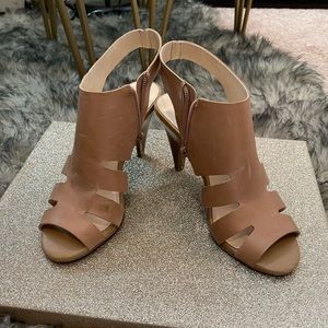 Slightly worn heels. Size 8, light tan color.